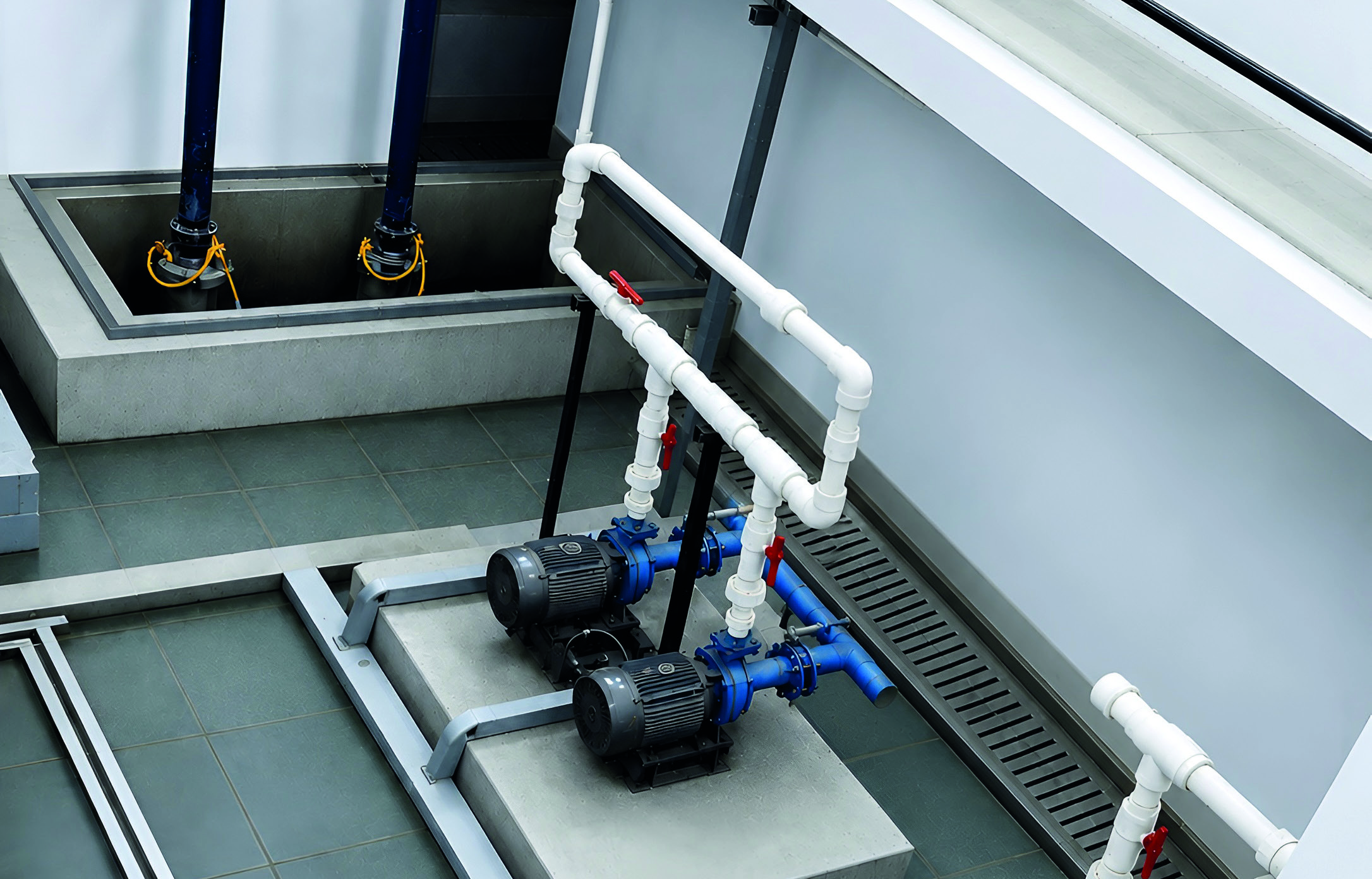 Installed pumps, valves and pipework, with access for inspection and servicing.